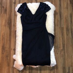 Navy blue knee-length dress size M, classic elegant style.